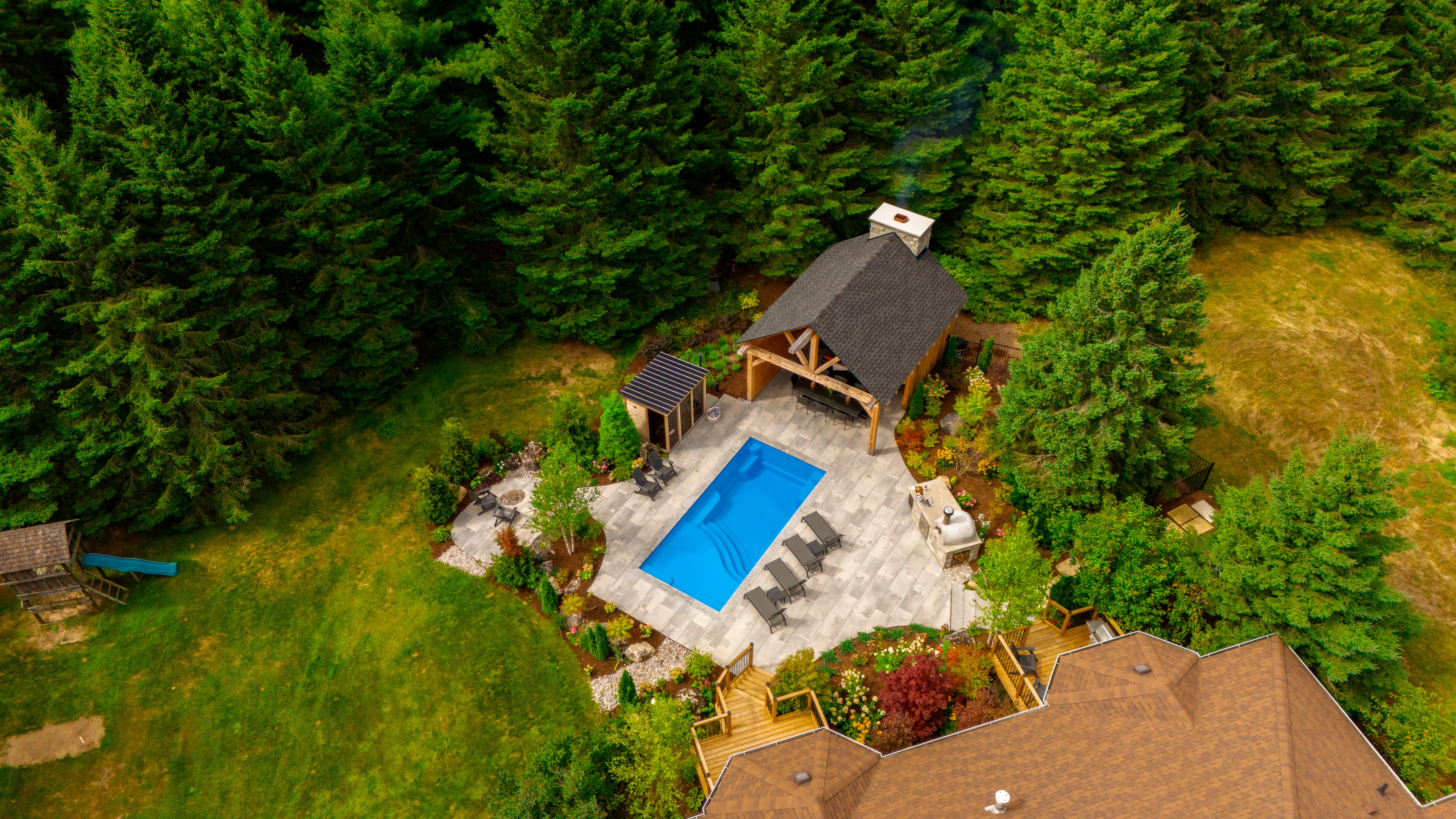 Completed Headwaters landscape project with architectural outdoor living and pool design