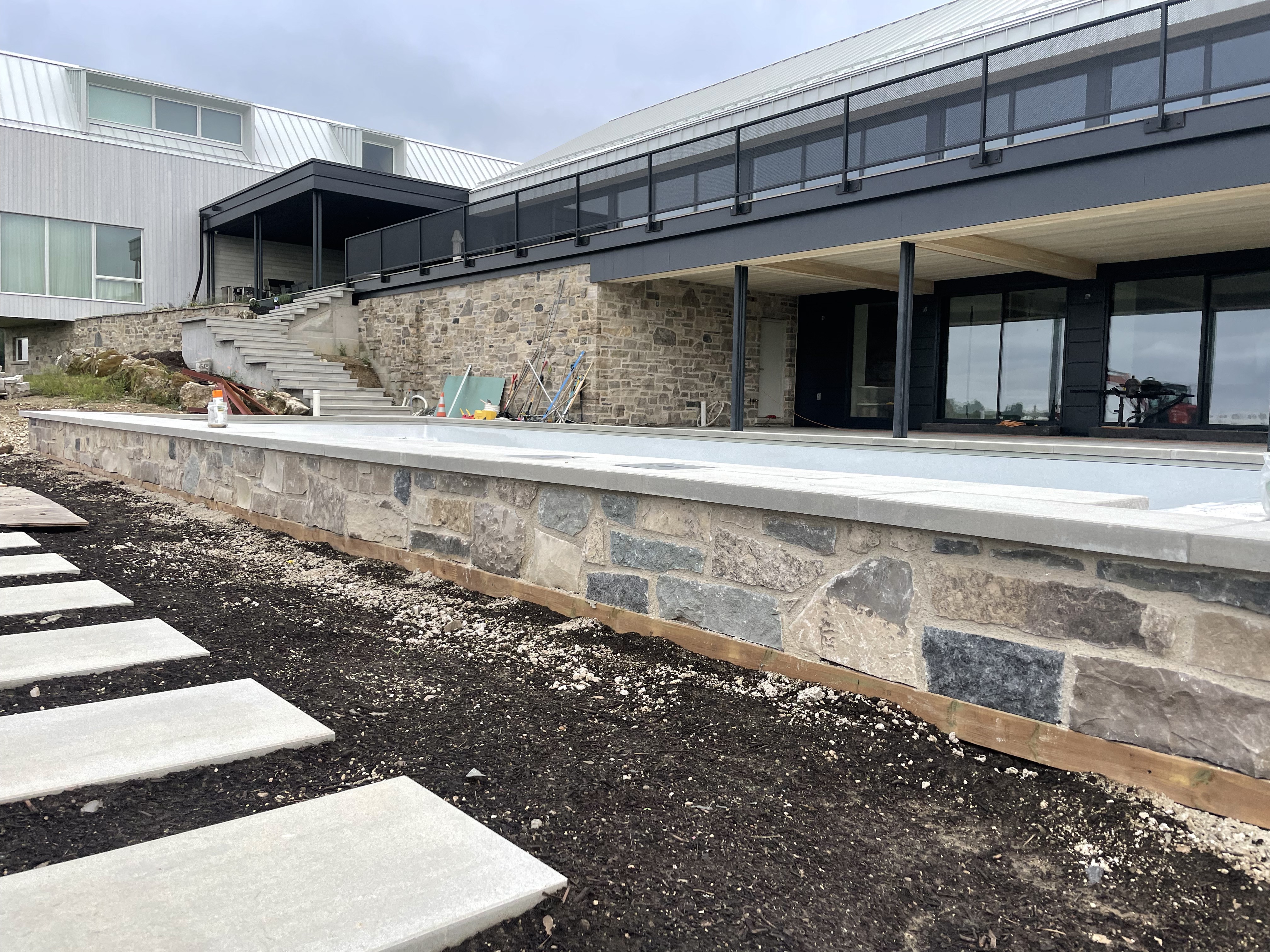 Modern Lakeside Overlook by Headwaters Landscape Design & Construction — construction progress view 8
