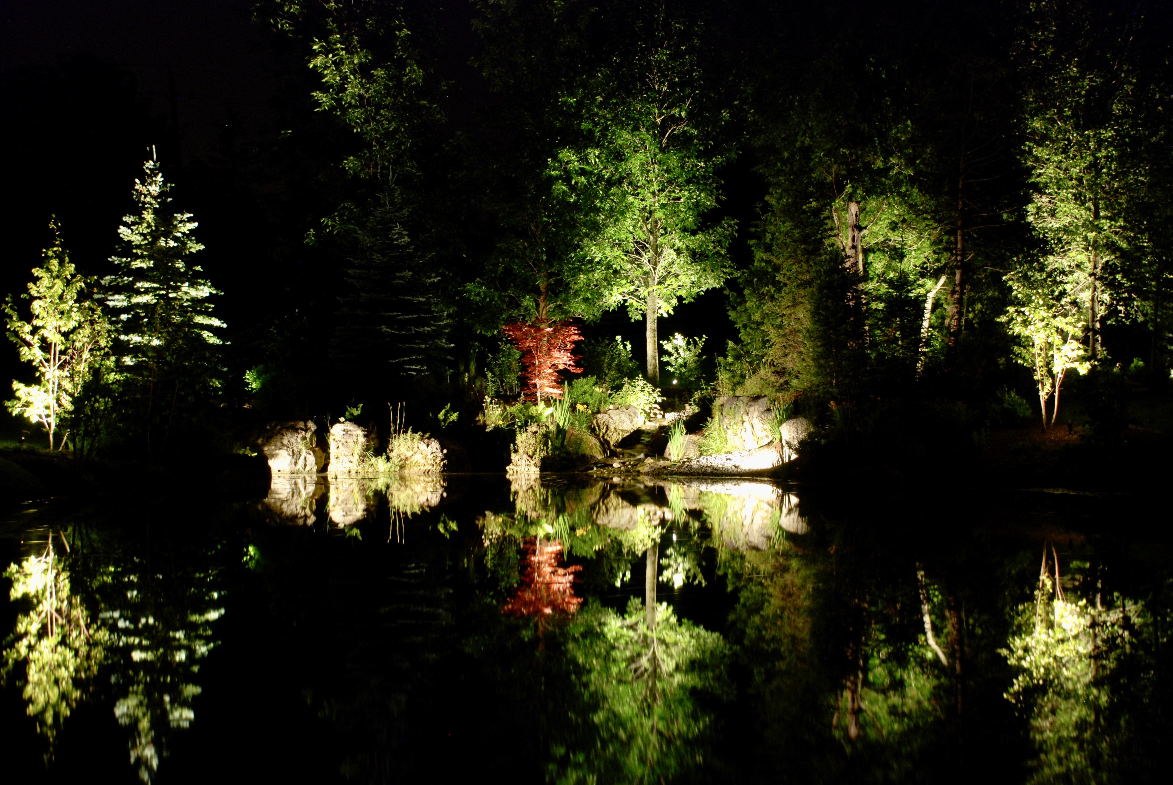 Nature's Reflections by Headwaters Landscape Design & Construction — evening lighting view